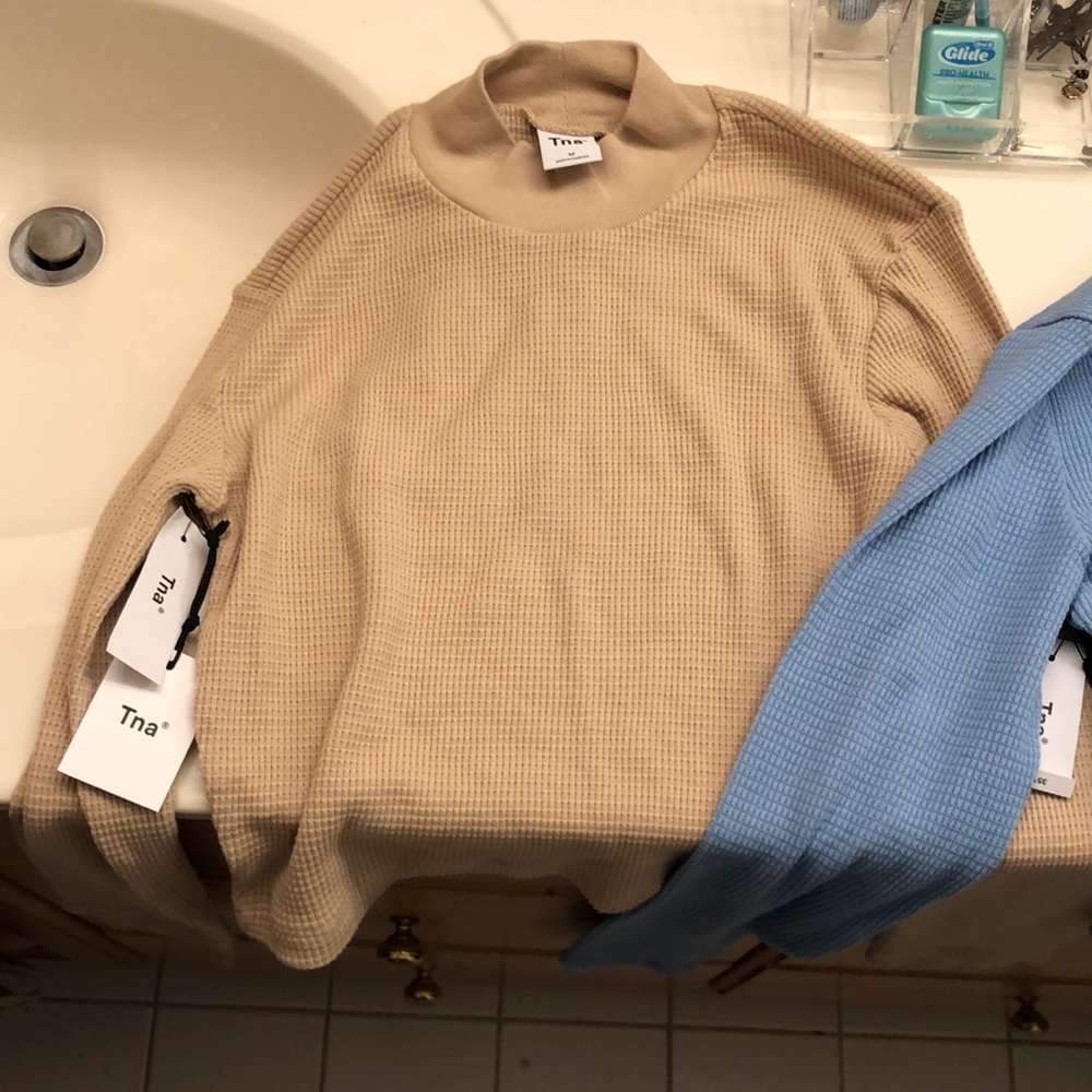 TNA Cropped Sweaters from Aritzia